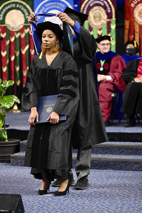 Brelinda Johnson, manager of the MTSU Scholars Academy, is hooded at her commencement Dec. 11 commencement ceremony. Johnson is the first higher education concentration graduate of the Assessment, Learning and Student Success Program. (MTSU photo by Andy Heidt)