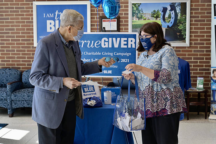 “Mr. MTSU” John Hood, left, director of governmental and community affairs, and Brenda Wonder, administrative coordinator for Facilities Services, conduct one of the weekly drawings in the Cope Administration Building lobby as part of the 2021-22 MTSU Employee Charitable Giving Campaign. (MTSU photo by Andy Heidt)