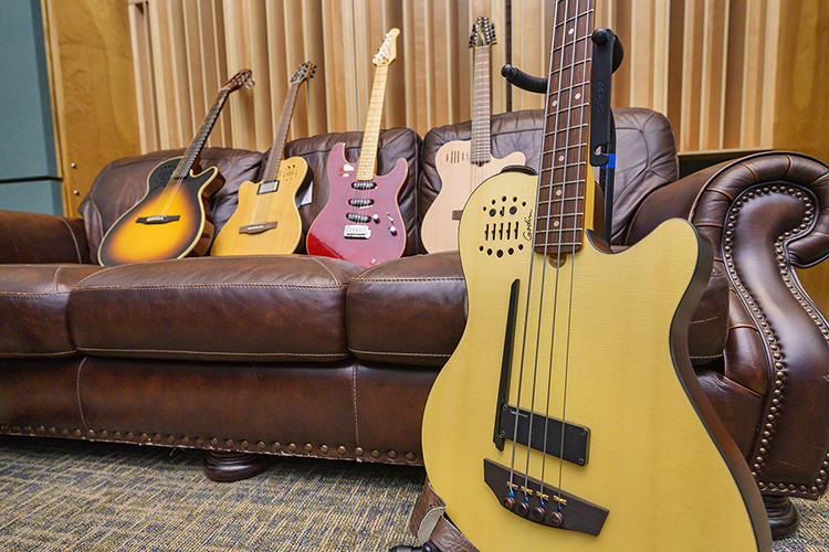 Some of the eight new Godin guitars donated by the Montreal-based manufacturer Dec. 16 to the Department of Recording Industry's Audio Engineering Program at Middle Tennessee State University are displayed on a couch in MTSU's Studio B in the Bragg Media and Entertainment Building. MTSU students will be able to check out the guitars just as they do other equipment needed for their recordings in the College of Media and Entertainment's five studios. (MTSU photo by Andy Heidt)