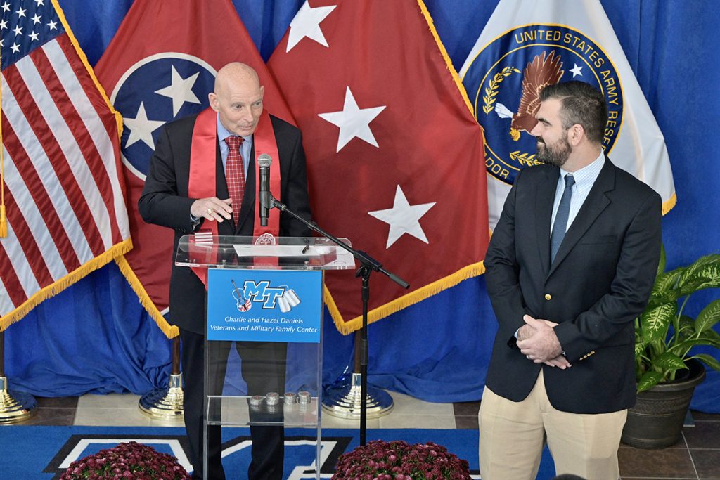 MTSU Graduating Veterans Stole Ceremony guest speaker Scott Lamb, right, listens while Keith M. Huber, the university’s senior adviser for veterans and leadership initiatives, shares information with the audience attending the fall 2021 Graduating Veterans Stole Ceremony Wednesday, Dec. 1, in the Miller Education Center. About 30 student veterans were recognized and presented red stoles they can wear at the Dec. 11 commencement. (MTSU photo by Andy Heidt)
