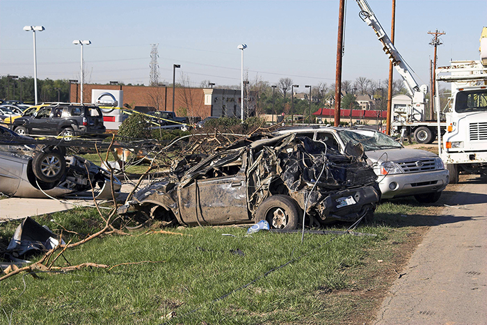 Damaged vehicles and downed power lines are strewn along Nashville Pike in Gallatin, Tenn., in front of a Nissan dealership in the wake of a deadly tornado outbreak in this April 2006 file image. Nine tornadoes touched down in Middle Tennessee on April 7, 2006, killing 10 people, including seven in Gallatin, and injuring hundreds more. Around 700 homes and businesses were damaged or destroyed in Sumner County alone, including several on the Volunteer State Community College campus. (Image by Ernest Prim/Adobe Stock Photos)