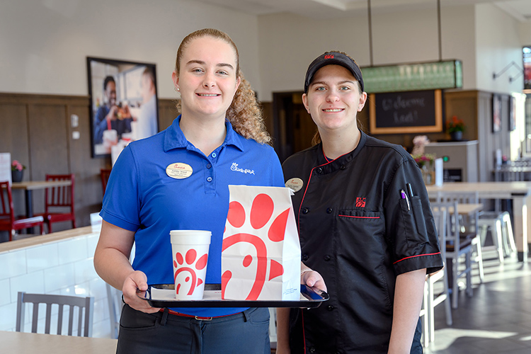 Ashley Wood, left, drive-thru manager, and Kaylin Garton, shift lead, are among Chick-fil-A Murfreesboro employees now eligible for tuition assistance to take courses at Middle Tennessee State University under an agreement signed Wednesday, Jan. 12, between the university and the fast-food chain. (MTSU photo by J. Intintoli)