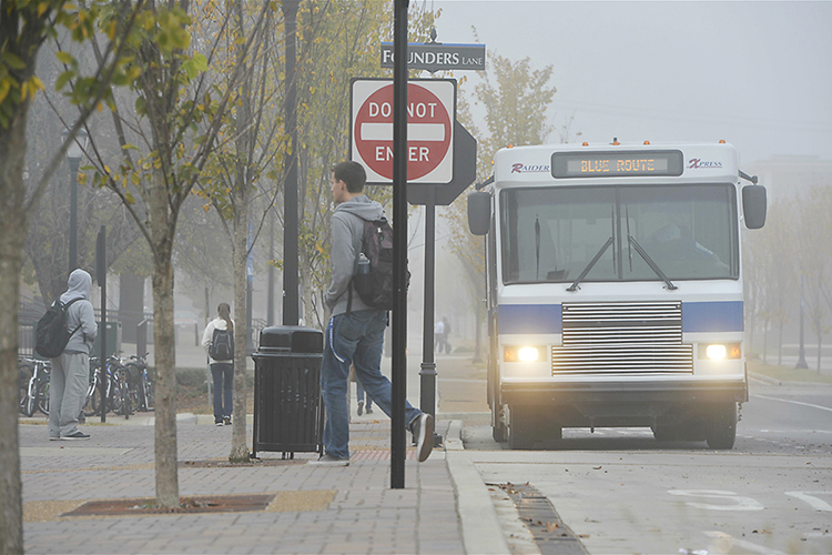 A Raider XPress shuttle pauses at the intersection of MTSU Boulevard and Founders Lane near the Business and Aerospace Building on a foggy late-fall morning in this file photo. The shuttle service is expanding its routes with a new "silver route," which will run between the James E. Walker Library in the central portion of campus and the Miller Education Center on Bell Street, about five blocks west. (MTSU file photo by J. Intintoli)