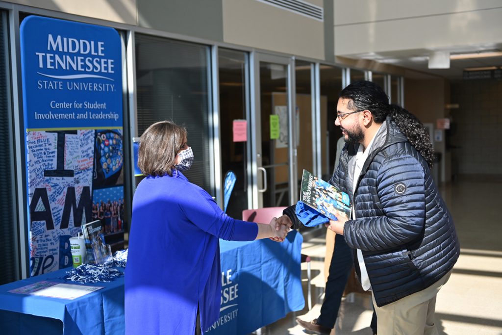 Jackie Victory, left, director of Student Organizations and Service for the Middle Tennessee State University Center for Student Involvement and Leadership, greets a student attending an MTSU Promise Tour event for prospective transfer students in January 2022. The tour to recruit new students at community colleges across Tennessee will begin Jan. 24 and end Feb. 9. The Murfreesboro university will visit Motlow, Volunteer State, Nashville State, Pellissippi State in Knoxville, Cleveland State, Chattanooga State, Columbia State, Jackson State and Dyersburg State. (MTSU file photo by James Cessna)