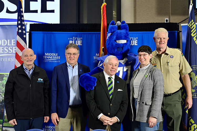 Pictured, from left, retired Lt. Gen. Keith Huber, senior adviser for veterans and leadership initiatives; MTSU Provost Mark Byrnes; former Middle Tennessee Council of the Boy Scouts of America President J.B. Baker, a member of the university’s Board of Trustees; Natalie Hoskins, an assistant professor of communication studies in the College of Liberal Arts and a founding adult leader of Troop 2019, and Council Scout Executive and CEO Larry Brown. Behind them is MTSU mascot Lightning. MTSU and Scout officials renewed their partnership at the 32nd annual MTSU Merit Badge University Saturday, Feb. 19, at MTSU. (MTSU photo by Cat Curtis Murphy)