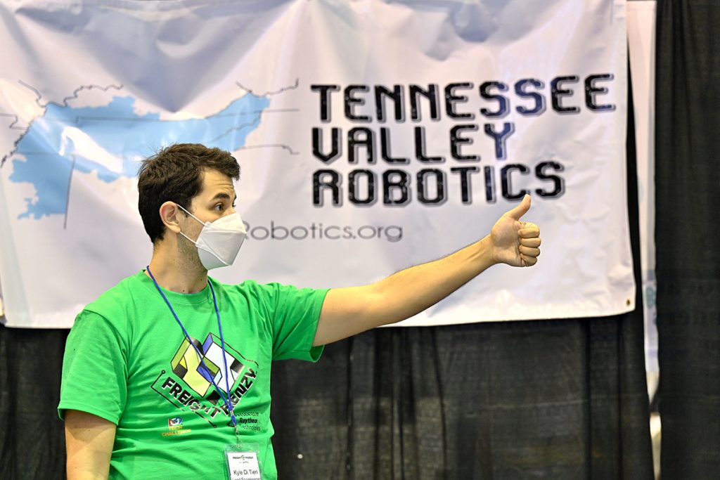 Kyle Di Tieri, coach of The Baylor School's Ohm Raiders team from Chattanooga, Tenn., gives his group a thumbs up during the recent Tennessee FIRST Tech Challenge robotics event held in MTSU's Alumni Memorial Gym. Ohm Raiders earned the Finalist Alliance Award and was runner-up for the Think Award. (MTSU photo by Cat Curtis Murphy)