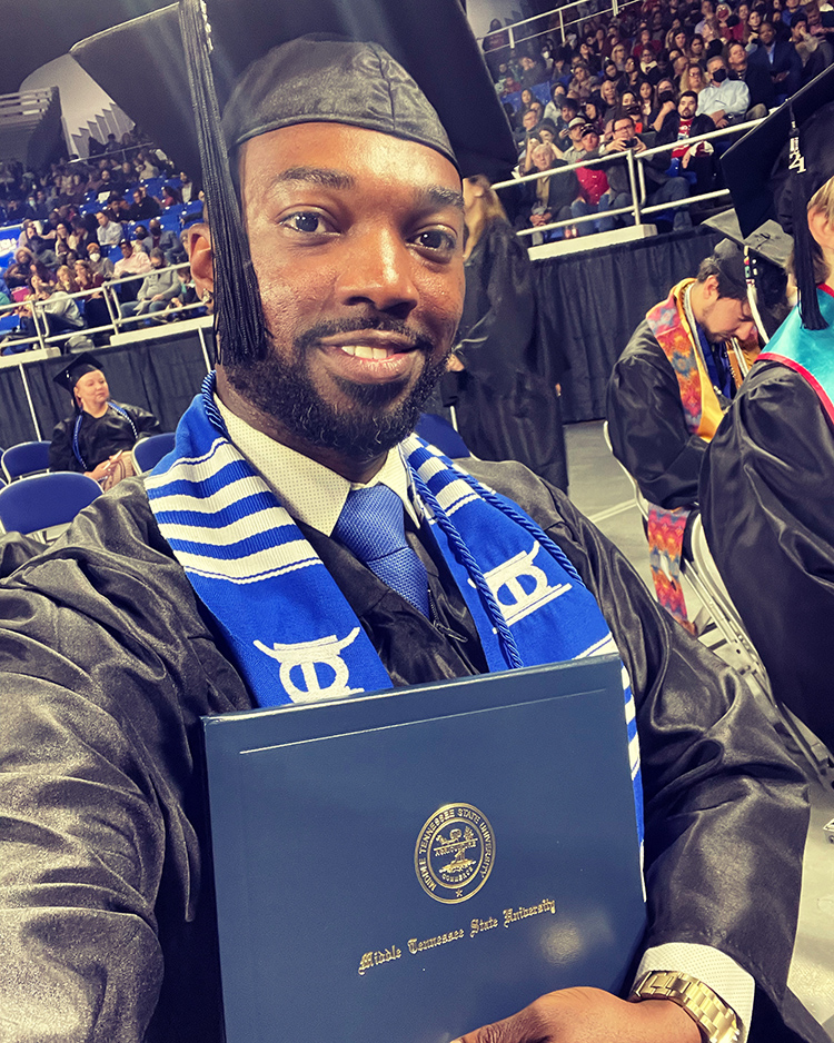 MTSU recording industry alumnus Terrance McGarr takes a selfie with his diploma after walking the stage of Murphy Center during the December 2021 commencement ceremony. (Photo courtesy of Terrance McGarr)