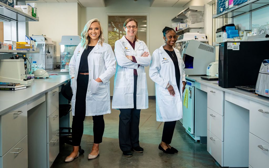 Associate professor Kelly Elkins, center, helped open the Towson University Human Remains Identification Lab in 2018. In that time, she has mentored current students Alexis Garloff, left, and Jordan Brooks in forensic chemistry and DNA recovery. Elkins will appear at MTSU Wednesday and Thursday, March 2-3, speaking at 6 p.m. on National Women’s History Month and forensics topics in the Science Building. Both talks, in Room 1003, are free and open to the public. (Photo by Alex Wright/Towson University)