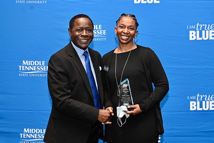 Brelinda Johnson, manager of the MTSU Scholars Academy, received the "Unsung Staff Award" Feb. 10 at the 26th annual Unity Luncheon. Congratulating her is MTSU President Sidney A. McPhee. (MTSU photo by J. Intintoli)
