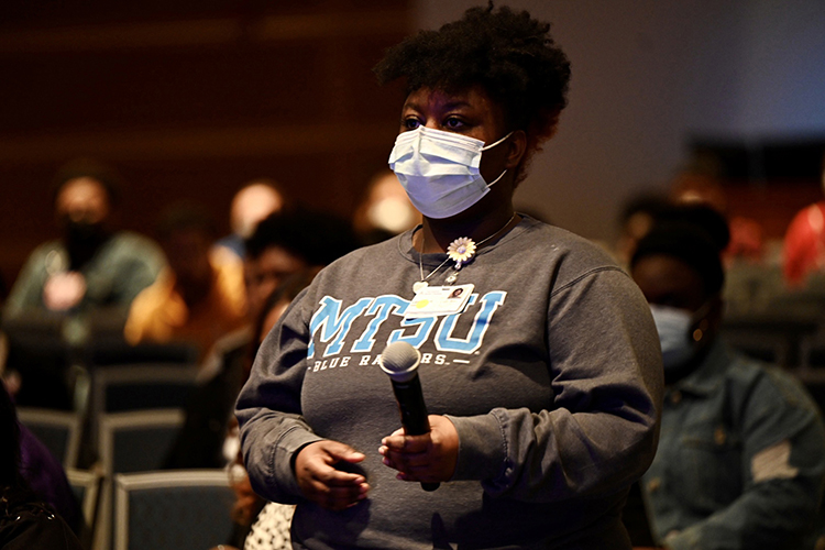 A student prepares to ask a question of Dr. Jacqueline "Jackie" Walters in the Q and A period following Walters' keynote address for Black History Month and National Women's History Month Feb. 28 at MTSU. Walters, an obstetrician/gynecologist and two-time breast cancer survivor, is featured on Bravo's "Married to Medicine" television program. (MTSU photo by James Cessna)