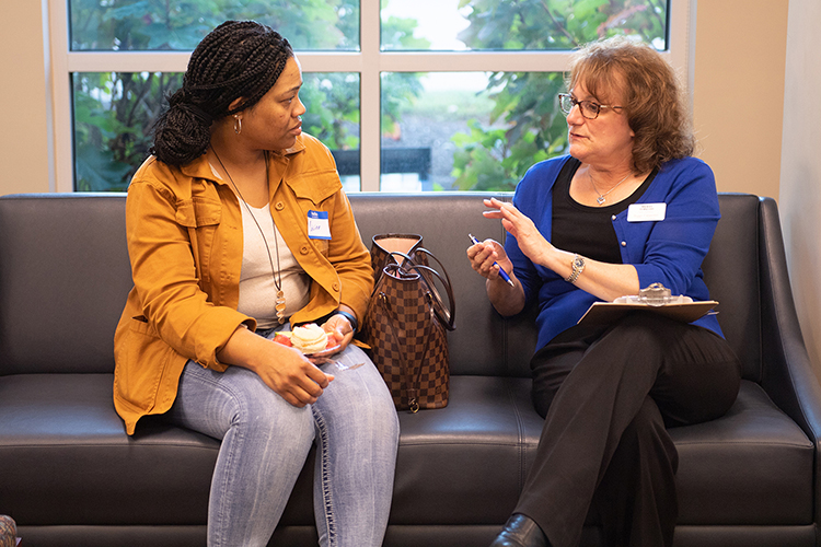 In this fall 2019 file photo, University College Assistant Dean Peggy Carpenter, left, answers questions from a prospective student during an open house at the Rutherford County Chamber of Commerce for adults to gain information to finish their degree. MTSU will be hosting another Q and A event March 22, 2022, at the chamber. (MTSU file photo by James Cessna)