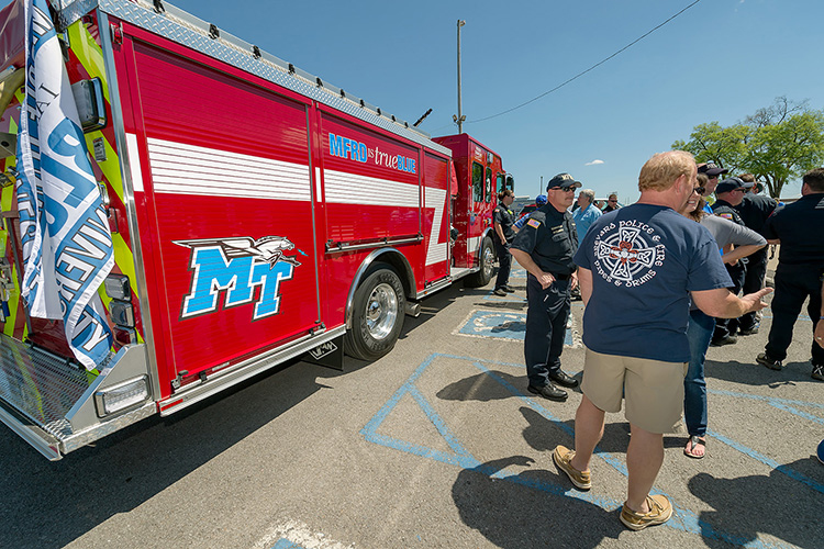 In this 2016 file photo, Murfreesboro Fire Rescue Department personnel await the unveiling of the new fire truck that will serve the MTSU campus. Working professionals such as these who are looking to earn a bachelor's degree are encouraged to pursue MTSU University College's new public safety concentration within its Integrated Studies major. (MTSU file photo by J. Intintoli) (MTSU file photo by Andy Heidt)