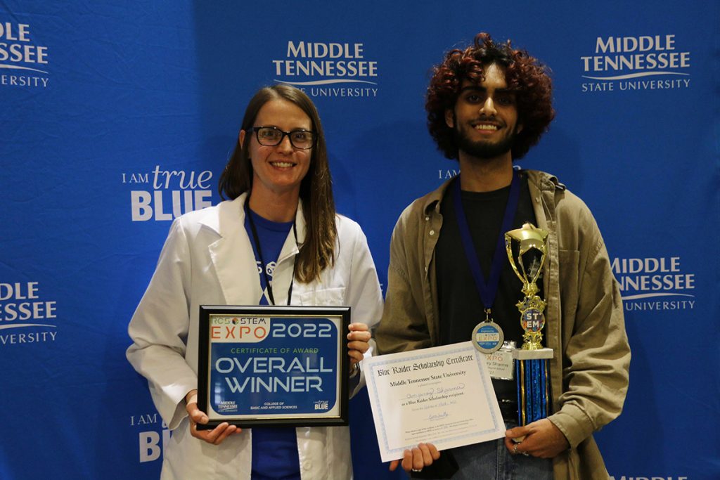 Stephanie Finley, left, Rutherford County Schools’ science specialist and RCS STEM Expo organizer, congratulates Anjaney Sharma of Central Magnet School for receiving the judges’ Best of Show for his project, a new and improved carabiner. He received a plaque and $1,000 scholarship from the MTSU College of Basic and Applied Sciences. (Submitted photo by Rutherford County Schools)