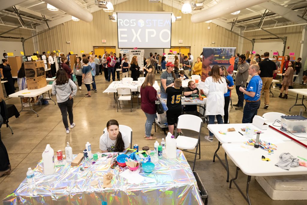 Rutherford County Schools' middle and high school students, teachers and family members mill about the Lane Agri-Park March 22 for the RCS STEM Expo. MTSU provided a $1,000 scholarship, other swag, judging and mentoring for the fourth annual event. (MTSU photo by James Cessna)