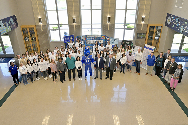 Representatives of MTSU and Murfreesboro's Siegel High School, as well as students of the Siegel Humanities Academy, celebrate the conclusion of the academy's first semester at an April 26 ceremony in the high school's first floor lobby. (MTSU photo by Andy Heidt)