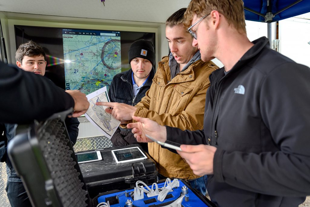 Senior students in assistant professor Kevin Corns' aerospace unmanned aircraft system's class study a map of Cummins Falls State Park in preparation for launching drones while on a mapping mission to complete a project in early April. The group includes Aidan Galdino, left, of Brentwood, Tenn., Zachary Whittle of Lafayette, Ga., Michael Clancy of Franklin, Tenn., and Calvin Harris of Snellville, Ga. (MTSU photo by J. Intintoli)