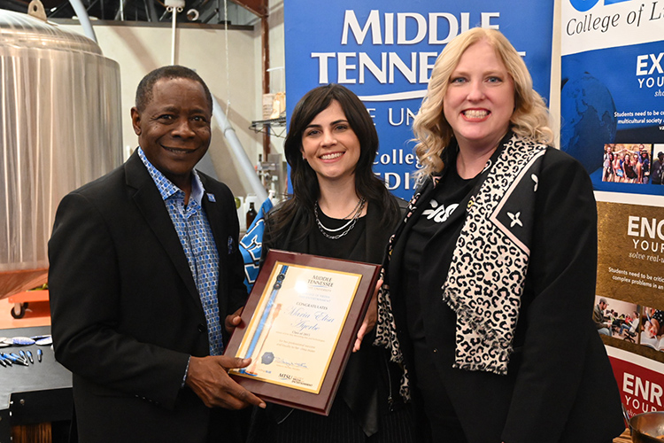 Grammy nominee Maria Elisa Ayerbe, who graduated from MTSU in 2015 with a master’s degree in recording arts and technologies, was honored Saturday by President Sidney A. McPhee and Media and Entertainment Dean Beverly Keel. (MTSU Photo by Andrew Oppmann)