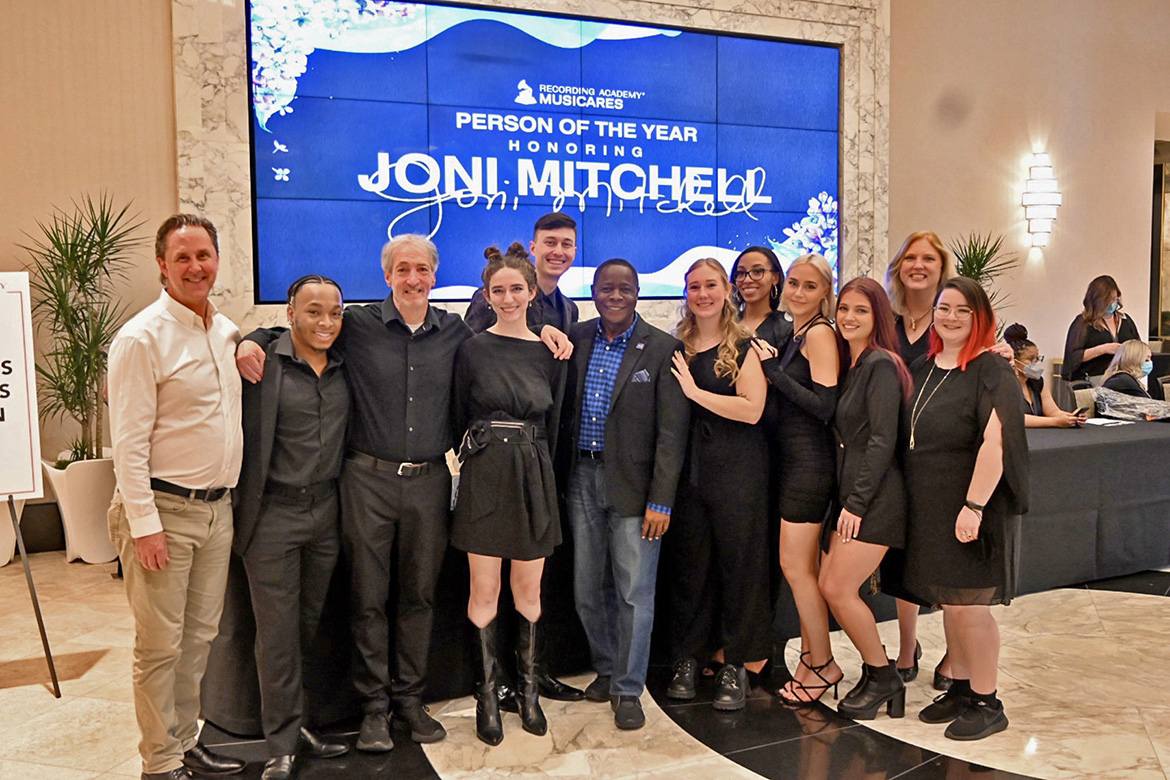 MTSU President Sidney A. McPhee, center, stands with faculty, students and recent alumni from the university’s College of Media and Entertainment at the entrance of Friday night’s MusiCares fundraiser at the site of the 2022 Grammy Awards in Las Vegas. (MTSU Photo by Andrew Oppmann)