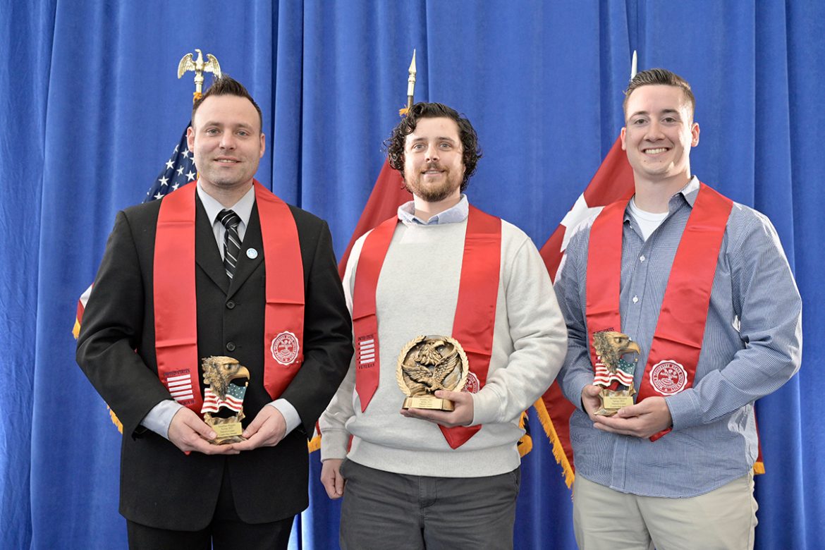 Jon Higgins, left, Jon Allen and Michael Maynard of Pleasant View, Tenn., show awards they received Wednesday, April 27, during the Graduating Veterans Stole Ceremony in the Miller Education Center on Bell Street. Higgins and Maynard were named co-winners of the Daniels Veterans Center Leadership Award. Allen received the Daniels Center/Journey Award. (MTSU photo by Andy Heidt)