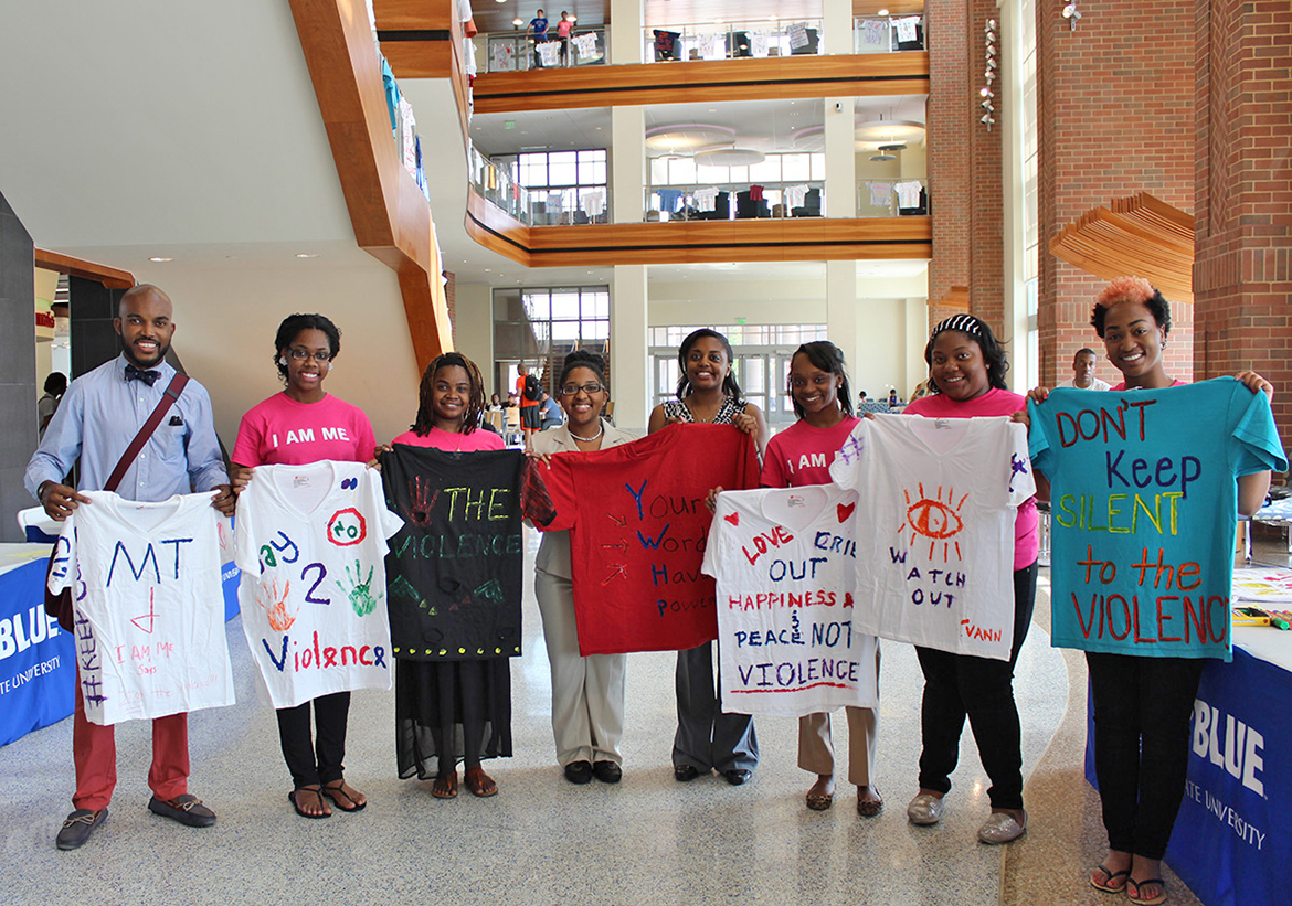 Participants in the 2021 Clothesline Project display T-shirts bearing Sexual Assault Awareness Month messages in the Student Union atrium. Other T-shirts hang from the rafters overhead. The 2022 Clothesline Project is scheduled for April 4-8. (Photo submitted)