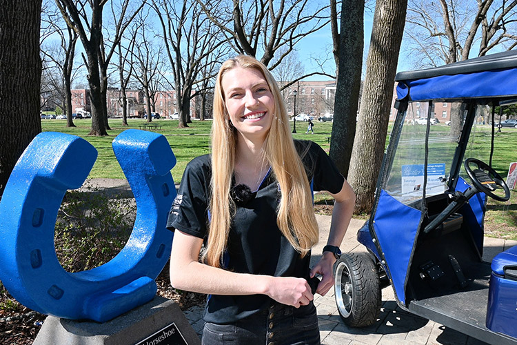 Lauren Alligood, Middle Tennessee State University graduate student and assistant, shares how she helps guide the College of Graduate Studies’ new golf cart campus tours for prospective students on March 17, 2022, in Walnut Grove on campus. (MTSU photo by Stephanie Barrette)