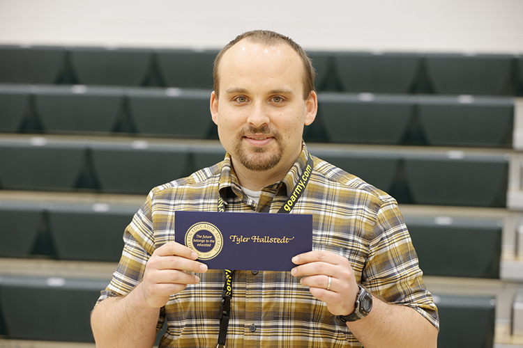Tyler Hallstedt, eighth-grade history teacher and Middle Tennessee State University graduate, received a Milken Educator Award recognizing him as an outstanding educator at an assembly at Mt. Juliet Middle School in Mt. Juliet, Tenn., on April 7, 2022. (Photo courtesy of Milken Family Foundation)