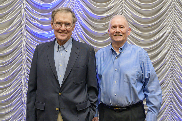 MTSU Professor Emeritus James "Jim" Rust, left, who recently retired from the Department of Psychology, smiles with retired colleague Steve Lewis of the Department of Marketing after the university’s annual Retired Employee Reception April 6 in the Student Union Ballroom. Rust was honored for his 48 years of service to the university, and Lewis was recognized for his 44 years of service. Another retired honoree, Joyce Vaughn of the Office of Housing and Residential Life, isn’t pictured; she also marked 48 years of service to MTSU. The 75 retiring employees honored at the ceremony for the 2021-22 academic year have a combined 1,959 years of service. (MTSU photo by Andy Heidt)