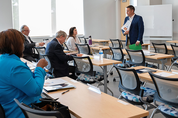 Joshua Aaron, standing at right, management professor and holder of the Wright Chair of Entrepreneurship, gives instructions to judges during the 2022 Business Plan Competition Finals held April 27 in the Academic Classroom Building. The event is presented by the Wright Chair within the Jones College of Business’ Department of Management and awards more than $25,000 in cash prizes to the finalists. (MTSU photo by Darby Campbell-Firkus)