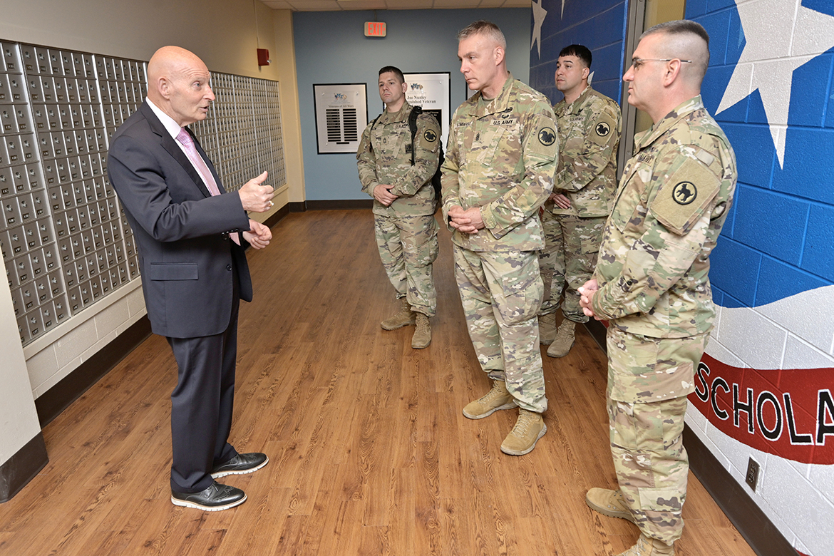 Keith M. Huber, left, MTSU senior adviser for veterans and leadership initiatives, welcomes U.S. Army Reserves to the Charlie and Hazel Daniels Veterans and Military Family Center on the first floor of Keathley University Center Tuesday, May 24. The special visitors include Master Sgt. Luke Klein, second from left, Command Sgt. Maj. Andrew Lombardo, Sgt. 1st Class Javier Orona and Command Sgt. Maj. Dennis Thomas. They met with various military and criminal justice officials, participated in lunch with Army Reserve groups from Nashville, Tenn., and took part in the Salute to Troops event Tuesday night at the Grand Ole Opry. (MTSU photo by Andy Heidt)