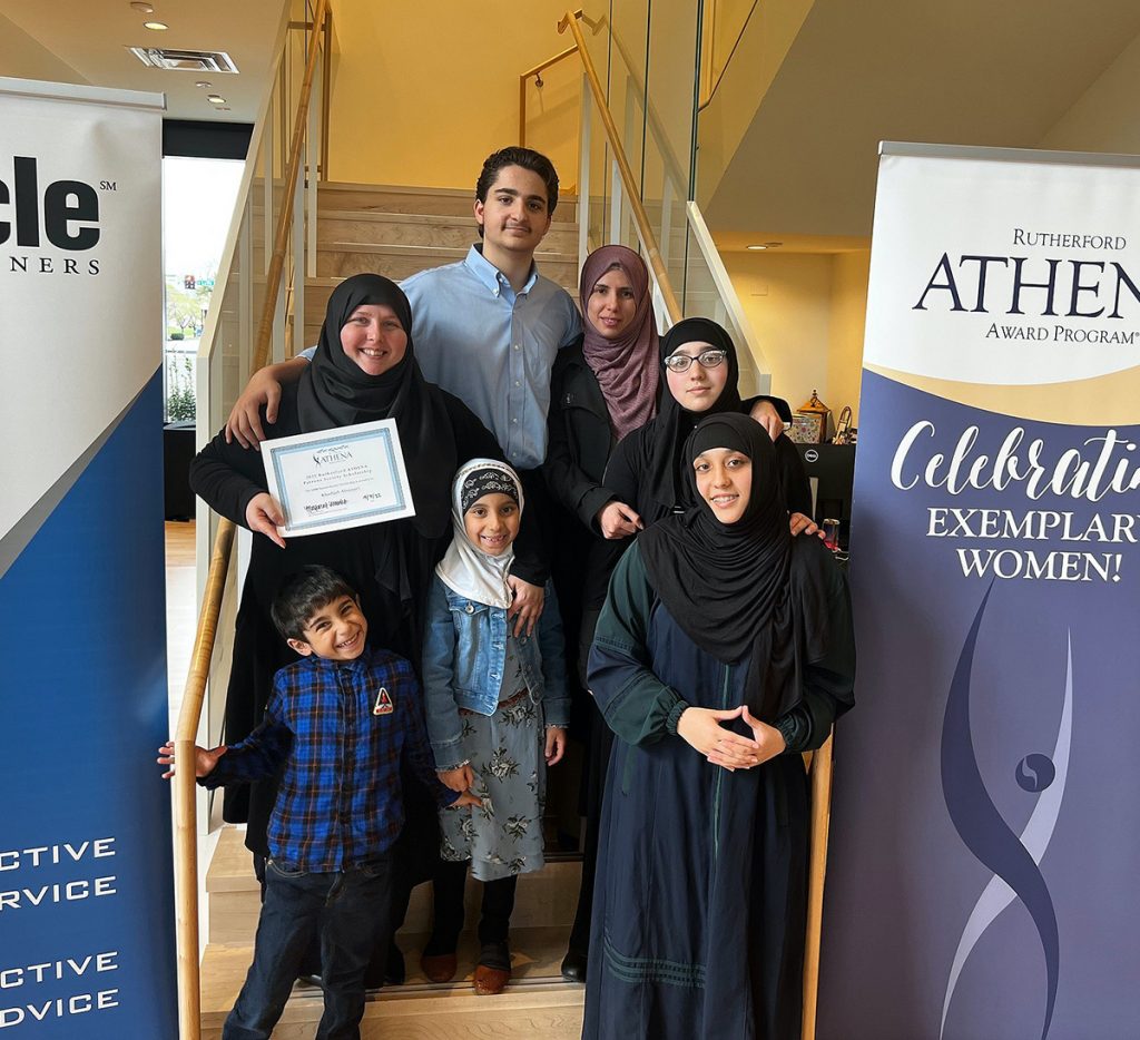 Holding the certificate she was presented after being recognized for earning the Rutherford ATHENA scholarship, Khadijah Alnassari is shown with family members including, clockwise, son Ahmed, 15, sister-in-law Salwi Alrubaye, daughters Fatima and Zaynab, both 15, daughter Zahara, 8, and son Muhammad Ali Alnassari, 5. The Rutherford County organization gave the $3,000 scholarship to Khadijah Alnassari Friday, April 29, during its annual awards luncheon at the Embassy Suites by Hilton Murfreesboro. (Submitted photo by Rutherford ATHENA)