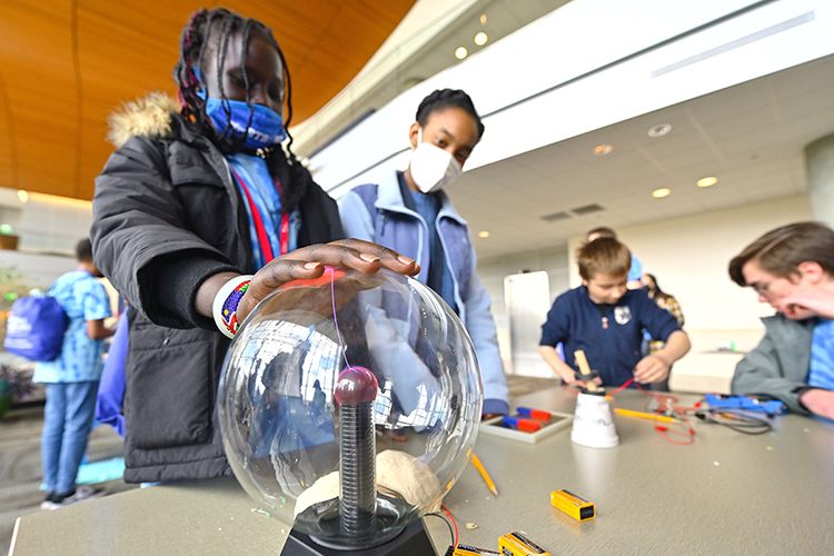 Participants enjoy one of the experiment stations at the 25th annual Tennessee Girls in STEM Conference at MTSU held in the Science Building Saturday, April 9. About 100 middle and 75 high school girls participated in the event that was all about science, technology, engineering and math. (MTSU photo by Cat Murphy Curtis)