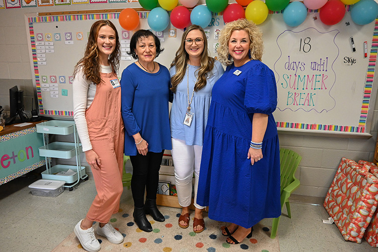 Kindergarten teacher Brooke Singleton from Rock Springs Elementary School, third from left, received the Mentor Teacher of Excellence Award from Middle Tennessee State University’s College of Education on April 29, 2022, at her classroom in La Vergne, Tenn. Pictured, from left, are MTSU education student and Singleton’s student teacher Caitlyn McKenzie Kritz, associate education professor Pam Ertel, Singleton and associate education professor Shannon Harmon. (MTSU photo by Stephanie Barrette)