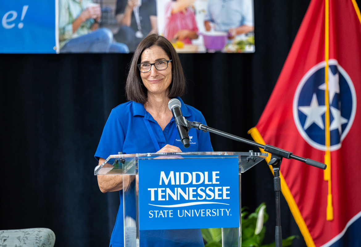 Dr. Deborah Lee, chair of the NHC Chair of Excellence in Nursing at MTSU and director and co-founder of the Positive Aging Consortium, welcomes some 100 attendees to MTSU's inaugural Positive Aging Conference June 10 at Miller Education Center. (MTSU photo by James Cessna)