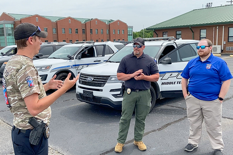 Lt. Andrew Bennett of the Middle Tennessee State University Police Department, left, instructs Lt. Jon Leverette, center, and Detective Trevor Chaney in the department’s annual Emergency Vehicle Operations Course training at the Smyrna Airport in Smyrna, Tenn., on June 10, 2022. (Photo courtesy of MTSU Police)