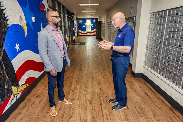 Retired Lt. Gen. Keith Huber, MTSU senior adviser for veterans and leadership initiatives, right, chats with Erik Moses, president of Nashville Superspeedway, just outside the Charlie and Hazel Daniels Veterans and Military Family Center inside Keathley University Center in mid-May during Moses’ visit to campus. MTSU and Nashville Superspeedway announced a partnership Thursday, June 9, to honor and support veterans. (MTSU photo by Andy Heidt)