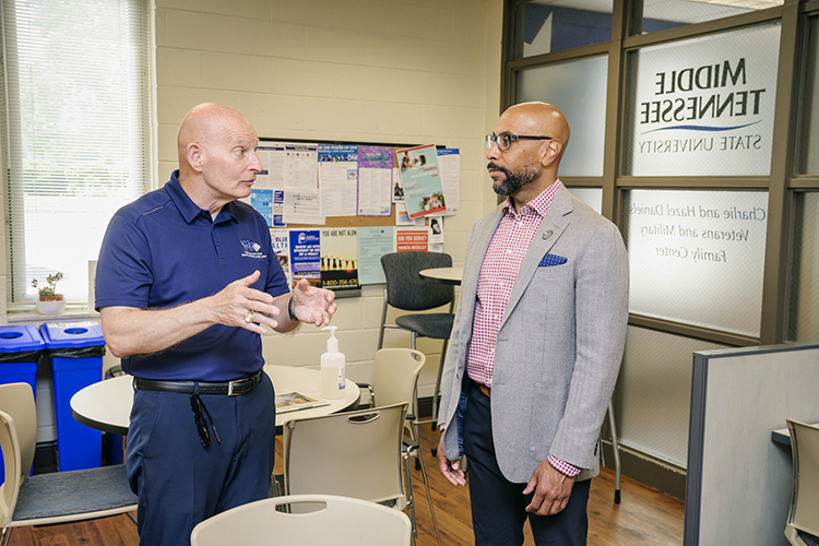 Retired Lt. Gen. Keith Huber, MTSU senior adviser for veterans and leadership initiatives, left, explains to Erik Moses, president of Nashville Superspeedway, the services provided to student veterans at the Charlie and Hazel Daniels Veterans and Military Family Center during Moses’ visit to campus in mid-May. MTSU and Nashville Superspeedway announced a partnership Thursday, June 9, to honor and support veterans. (MTSU photo by Andy Heidt)