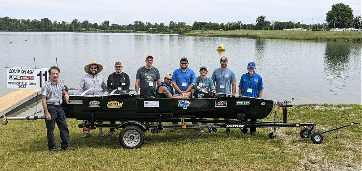 MTSU solar boat team members are shown with their watercraft at the 2022 Solar Splash competition on Champions Park Lake in Springfield, Ohio. Members include Experimental Vehicles Program Director Saeed Foroudastan, left, Riley Frye, Ben Garrettson, captain Hunter Hudson, Tyler Burns, Hunter McMath, Dan Hannett and Rick Taylor. (Submitted photo)