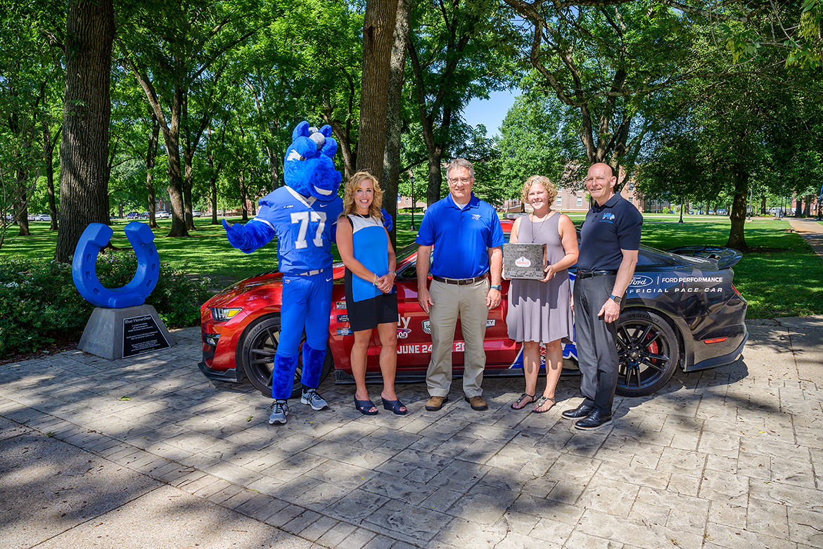 rom left, MTSU mascot Lightning; Hilary Miller, director of the Charlie and Hazel Daniels Veterans and Military Family Center; MTSU Provost Mark Byrnes; Paige Cuiffo, director of client services for Nashville Superspeedway; and retired Lt. Gen. Keith Huber, senior adviser for veterans and leadership initiatives, stand in front of the pace car for the Nashville Superspeedway NASCAR events Thursday, June 9, at the Blue Horseshoe in Walnut Grove. MTSU and Nashville Superspeedway announced a partnership to honor and support veterans. (MTSU photo by Andy Heidt)