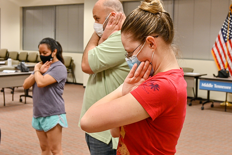 In this September 2021 file photo, Katelynn Erksine, Middle Tennessee State University master patrol officer, and Sgt. Jason Hurley demonstrate blocking a choke during last year’s self-defense Rape Aggression Defense Systems, or RAD, course. Registration is open for the next RAD course that begins July 5, 2022. (MTSU file photo by Stephanie Barrette)