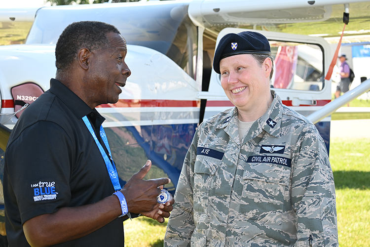 MTSU President Sidney A. McPhee, left, and Brig. Gen. Regena Aye, vice commander of Civil Air Patrol, chat Tuesday, July 26, during the 2022 EAA AirVenture in Oshkosh, Wis. (MTSU photo by Andrew Oppmann)