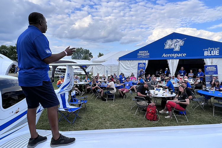 MTSU President Sidney A. McPhee addresses a host of alumni and supporters Wednesday, July 27, during a barbeque reception at MTSU’s large tent at the 2022 EAA AirVenture in Oshkosh, Wis. (MTSU photo by Andrew Oppmann)