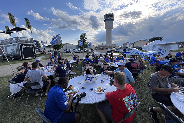 Middle Tennessee State University’s Aerospace Department welcomed more than 100 alumni and supporters for a barbecue reception outside the university’s tent Wednesday, July 27, at EAA AirVenture in Oshkosh, Wis. (MTSU photo by Andrew Oppmann)