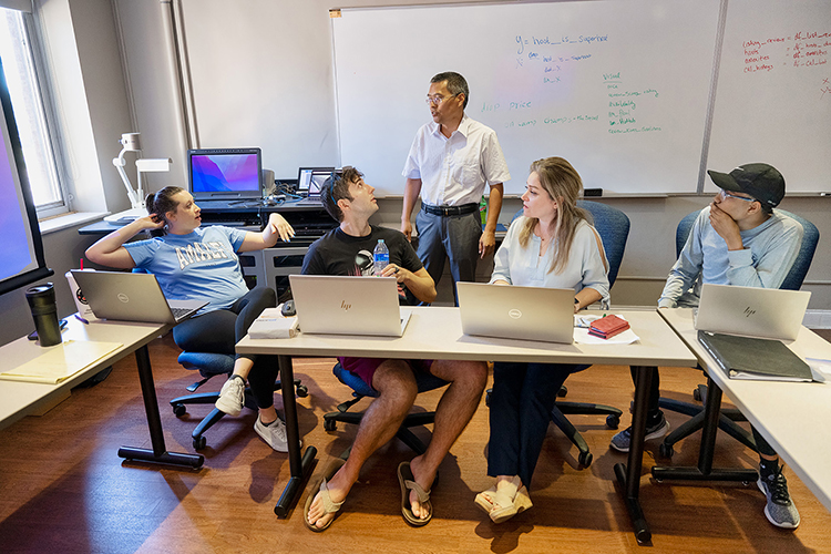 Middle Tennessee State University professor Qiang Wu, center, director of the university’s new Data Science master’s program works with students, from left, Lindsay Rogerson, Curtis Corazao, Wu, Afsaneh Caden and Ray Hill during the Data Dive event held June 18, 2022, inside Kirksey Old Main. (MTSU photo by James Cessna)
