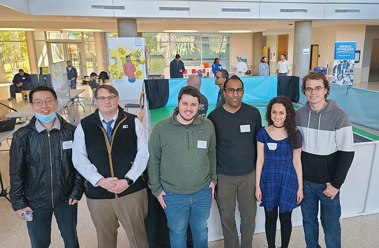 Middle Tennessee State University student David Jean, second from left, is one of 20 students starting Middle Tennessee State University’s new Data Science master’s program this fall. Jean poses here for a photo with his Deep Racer team during the November 2021 Deep Racer event in the Science Building atrium on campus. (Photo courtesy of David Jean)