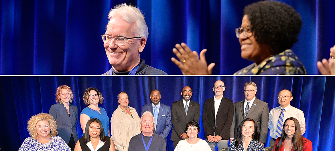 MTSU psychology professor Tom Brinthaupt, at top, smiles as his colleagues, including College of Liberal Arts Dean Leah Tolbert Lyons, right, applaud him Thursday, Aug. 18, in Tucker Theatre during the 2022 Fall Faculty Meeting. Brinthaupt received the MTSU Foundation's Career Achievement Award, the university's highest faculty honor, at the event, which precedes the first day of classes for each new academic year. In the photo below, Brinthaupt is joined by ten more MTSU professors who also received awards from the MTSU Foundation for their accomplishments in and outside the classroom, along with university President Sidney A. McPhee, alumnus and MTSU Foundation President Ronald Roberts and University Provost Mark Byrnes. (MTSU photos by Andy Heidt)