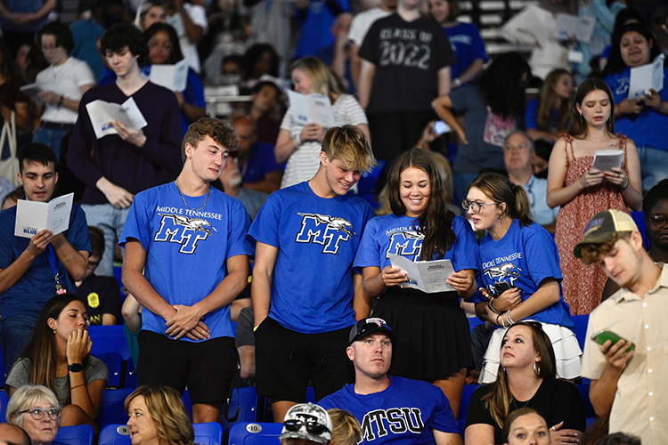 Middle Tennessee State University students read the program for the University Convocation, which was held for new freshmen and transfer students in August 2022 in Murphy Center. This year’s Convocation, which is open to the public, begins at 2 p.m. Saturday, Aug. 26, in Murphy Center. (MTSU file photo by J. Intintoli)