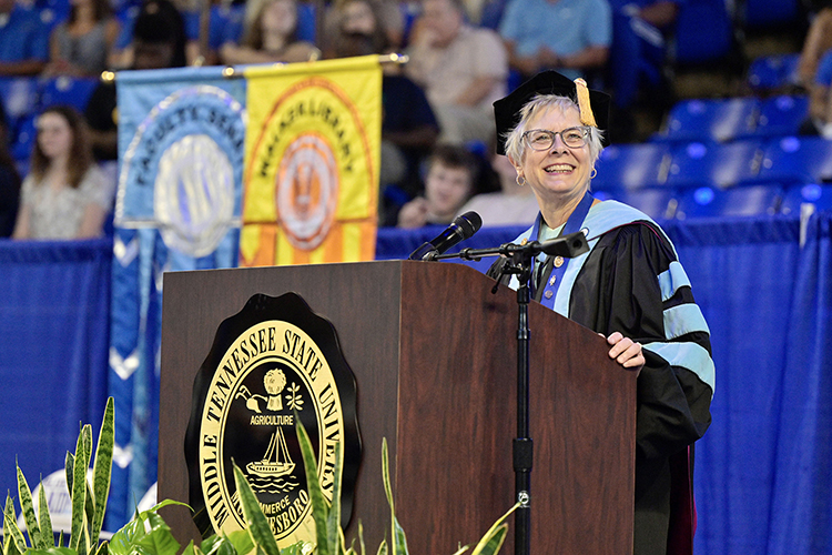 Dr. Debra Sells, vice president for student affairs and vice provost for enrollment and academic services at MTSU, addresses the 2022 University Convocation audience Aug. 21 at Murphy Center.