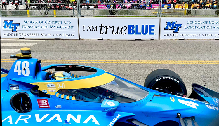 An Indy Car prepares for a practice run with MTSU-branded signage in the background in preparation of the Big Machine Music City Grand Prix set for Aug. 5-7 in Nashville, Tenn. ( MTSU photo by Andrew Oppmann)
