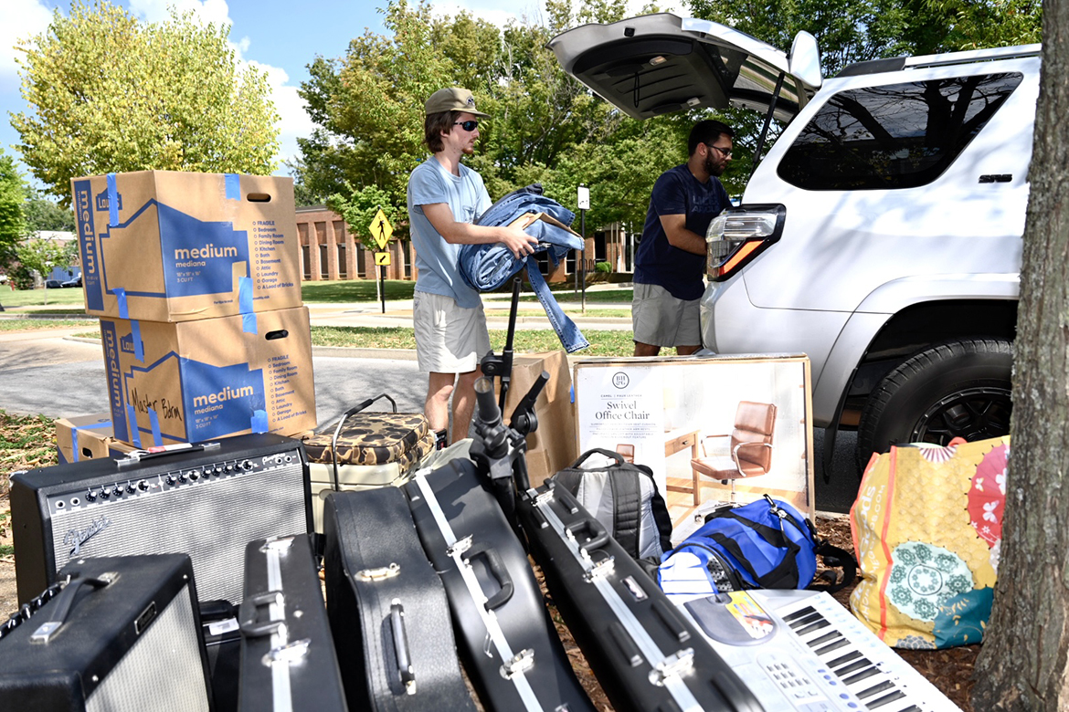 A new MTSU student with an obvious passion for music receives help unloading instruments, an office chair and other items from a vehicle outside Jim Cummings Hall Friday, Aug. 19, during the next to last move-in day to campus. By weekend’s end, about 850 students will have moved into campus housing during the final two days before the start of fall semester classes on Monday, Aug. 22. Around 2,900 students will be living in campus housing this fall. (MTSU photo by J. Intintoli)