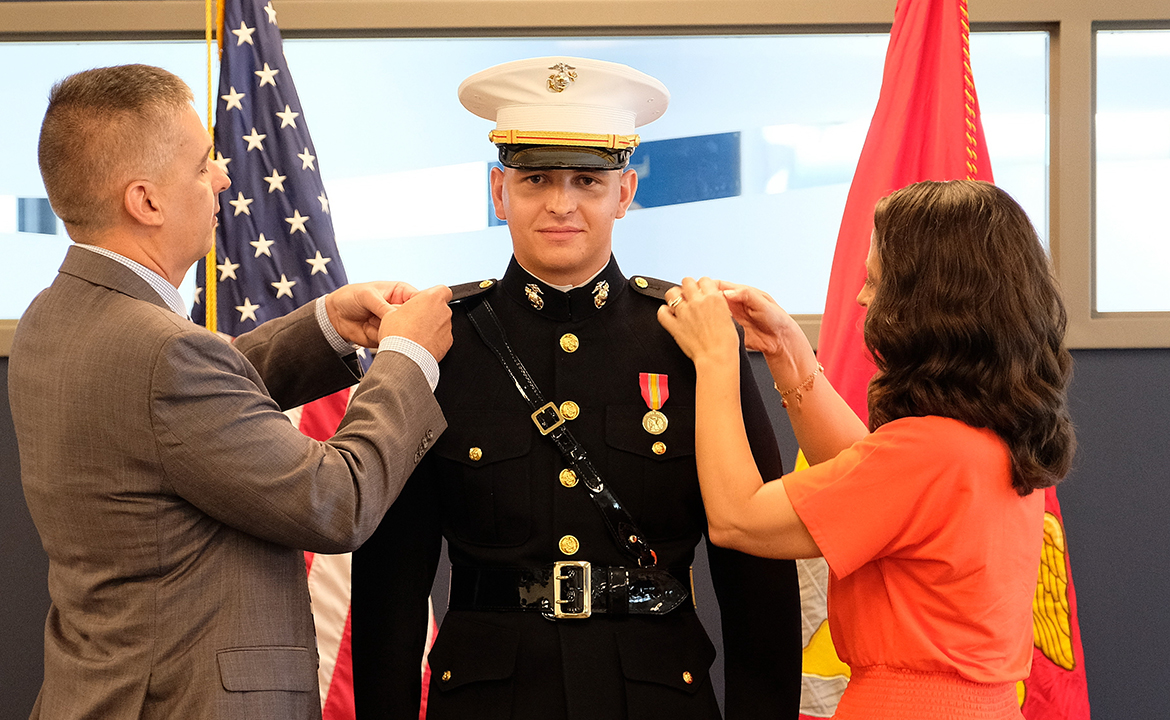 Greg, left, and Molly Marshall pin the second lieutenant bars on their son, Riley Marshall, during a mid-July U.S. Marines commissioning ceremony. An MTSU aerospace pro pilot major, Riley Marshall will report Oct. 17 for basic school and spend six months at Quantico, Va., then eventually train as a naval aviator at the Navy air base in Pensacola, Fla. (Submitted photo)